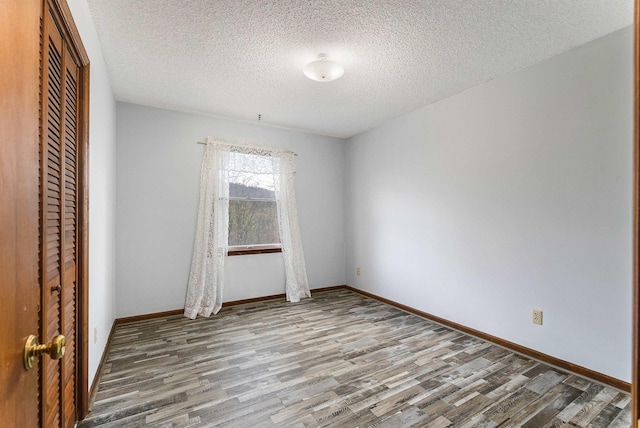 183 Deer Dr, Mcgaheysville, VA 22840 - unfurnished room with wood finished floors and a textured ceiling