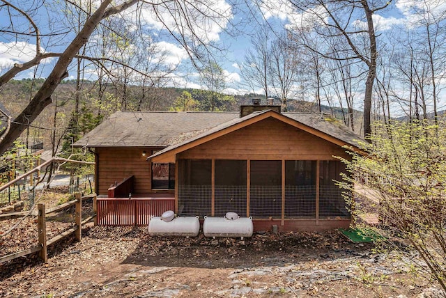 183 Deer Dr, Mcgaheysville, VA 22840 - back of house with a sunroom, a chimney, a shingled roof, and a deck