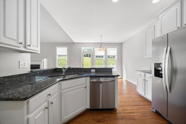 239 Windsor Dr, Fishersville, VA 22939 - kitchen with stainless steel appliances, white cabinetry, dark wood finished floors, and a peninsula