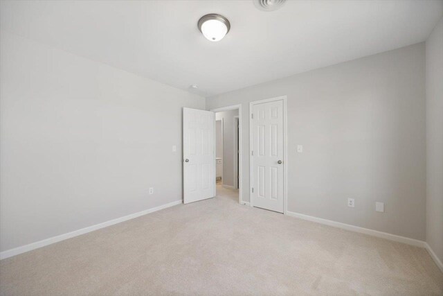239 Windsor Dr, Fishersville, VA 22939 - unfurnished bedroom with light colored carpet and baseboards