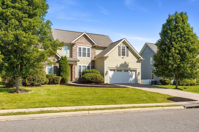 239 Windsor Dr, Fishersville, VA 22939 - view of front of home with stone siding, driveway, a garage, and a front yard