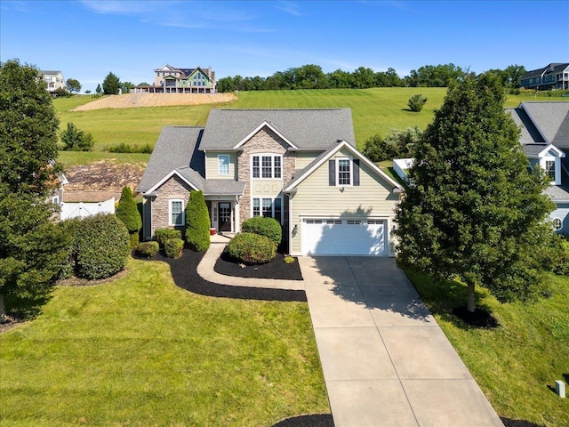 239 Windsor Dr, Fishersville, VA 22939 - view of front of home with stone siding, concrete driveway, a front yard, and an attached garage