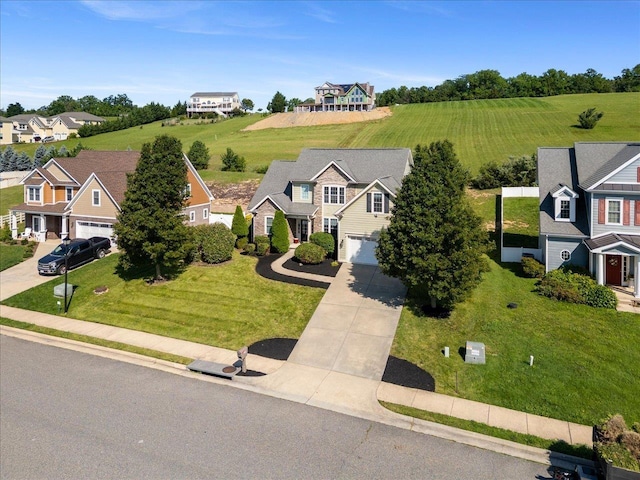 239 Windsor Dr, Fishersville, VA 22939 - view of front facade with driveway, a garage, and a residential view