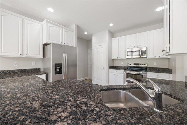 239 Windsor Dr, Fishersville, VA 22939 - kitchen featuring appliances with stainless steel finishes, dark stone counters, white cabinetry, and recessed lighting