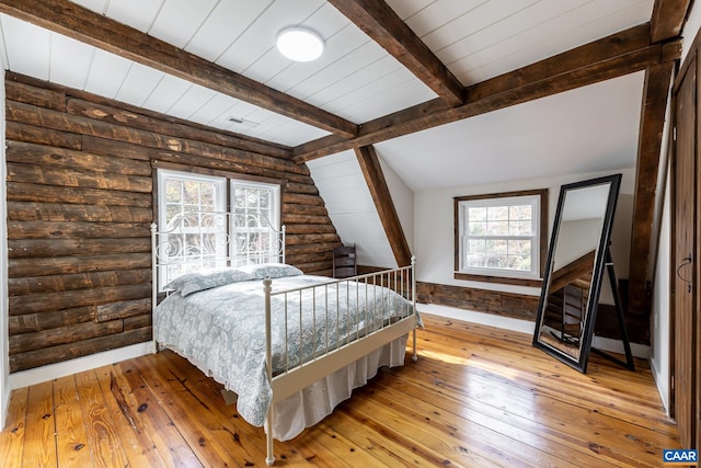 2395 Mountain Brook Dr, Charlottesville, VA 22902 - bedroom with rustic walls, hardwood / wood-style floors, and vaulted ceiling with beams