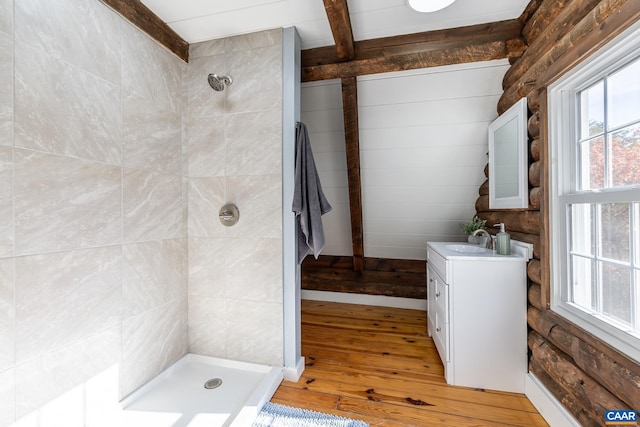 2395 Mountain Brook Dr, Charlottesville, VA 22902 - full bathroom with vanity, beam ceiling, wood-type flooring, and a tile shower
