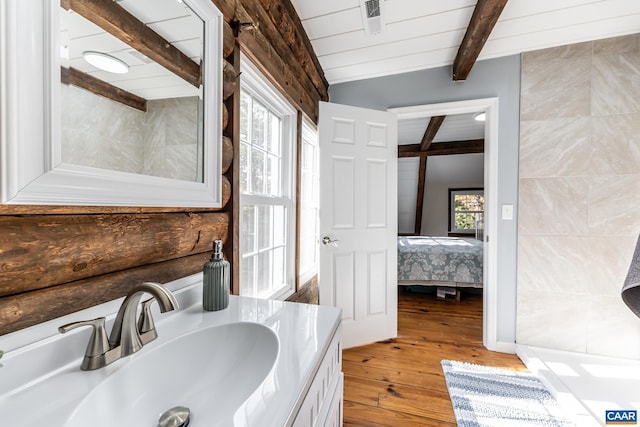 2395 Mountain Brook Dr, Charlottesville, VA 22902 - bathroom featuring wood-type flooring, lofted ceiling with beams, visible vents, ensuite bath, and vanity