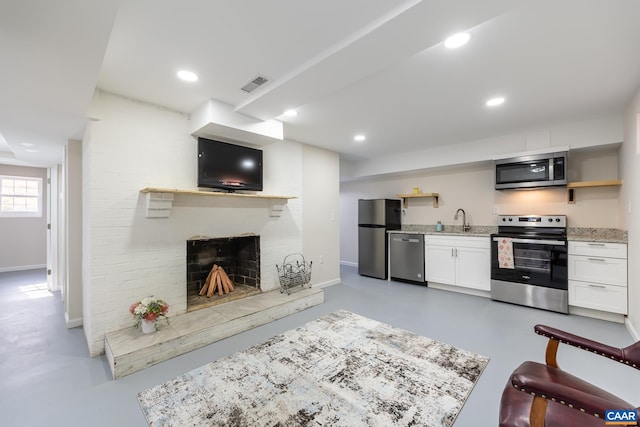 2395 Mountain Brook Dr, Charlottesville, VA 22902 - living room with finished concrete floors, a brick fireplace, baseboards, and visible vents