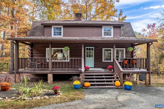 2395 Mountain Brook Dr, Charlottesville, VA 22902 - cabin with central air condition unit, a porch, a chimney, and log exterior