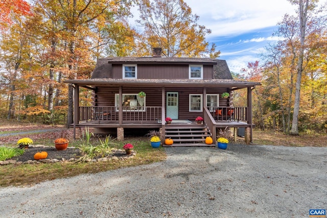 2395 Mountain Brook Dr, Charlottesville, VA 22902 - view of front of home featuring log siding, roof with shingles, a chimney, and a porch