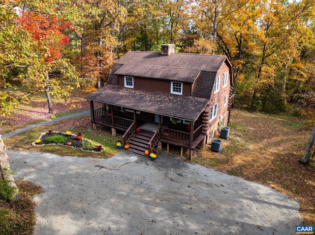 2395 Mountain Brook Dr, Charlottesville, VA 22902 - view of front of house with a porch, roof with shingles, central air condition unit, a gambrel roof, and a chimney