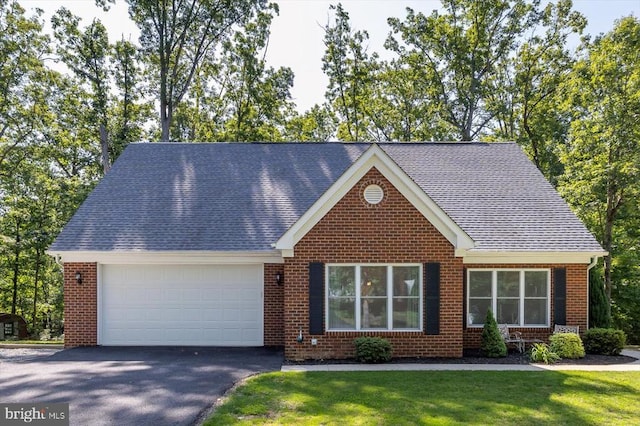 205 Saylers Crk, Locust Grove, VA 22508 - view of front of house featuring a garage, brick siding, asphalt driveway, and a front yard