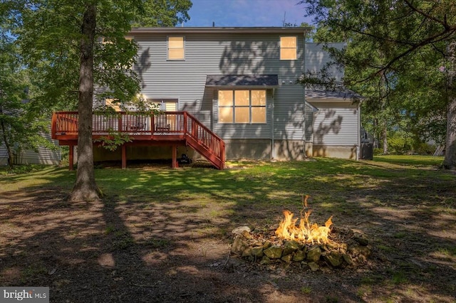 205 Saylers Crk, Locust Grove, VA 22508 - back of property featuring a wooden deck, a fire pit, and a lawn