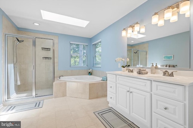 205 Saylers Crk, Locust Grove, VA 22508 - bathroom with a skylight, a shower stall, a garden tub, double vanity, and tile patterned flooring