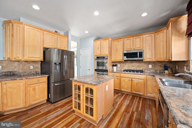5606 Joshua Tree Cir, Fredericksburg, VA 22407 - kitchen featuring appliances with stainless steel finishes, a sink, wood finished floors, glass insert cabinets, and recessed lighting