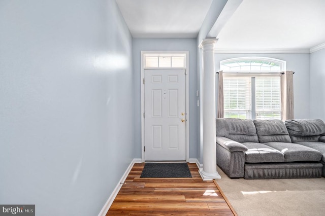 5606 Joshua Tree Cir, Fredericksburg, VA 22407 - entryway featuring decorative columns, wood finished floors, baseboards, healthy amount of natural light, and crown molding