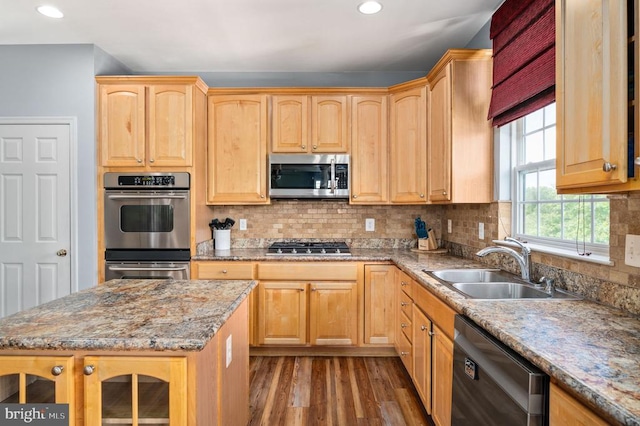 5606 Joshua Tree Cir, Fredericksburg, VA 22407 - kitchen featuring appliances with stainless steel finishes, wood finished floors, a sink, recessed lighting, and light stone countertops