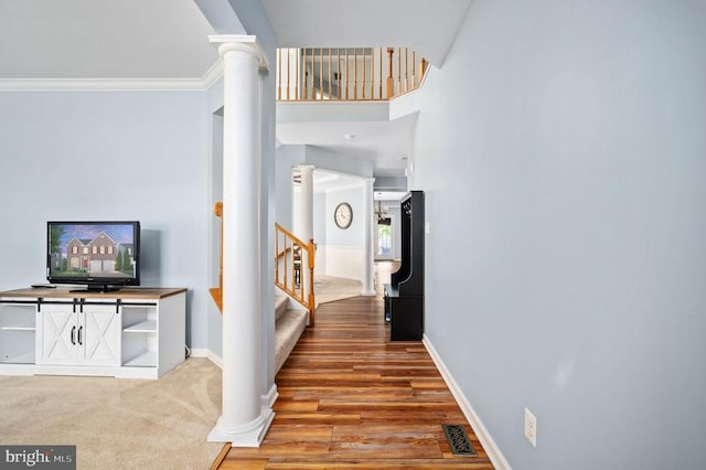 5606 Joshua Tree Cir, Fredericksburg, VA 22407 - entrance foyer with decorative columns, light wood finished floors, stairs, and baseboards