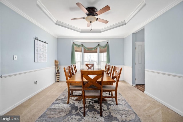 5606 Joshua Tree Cir, Fredericksburg, VA 22407 - carpeted dining room featuring a raised ceiling, a ceiling fan, ornamental molding, and baseboards