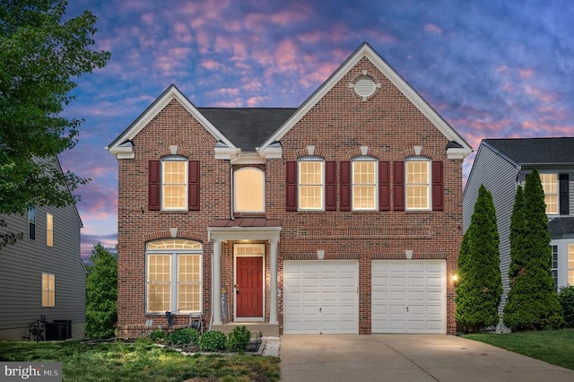 5606 Joshua Tree Cir, Fredericksburg, VA 22407 - view of front of house with brick siding, concrete driveway, an attached garage, and cooling unit