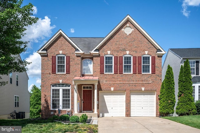 5606 Joshua Tree Cir, Fredericksburg, VA 22407 - view of front of house with brick siding, concrete driveway, an attached garage, and cooling unit