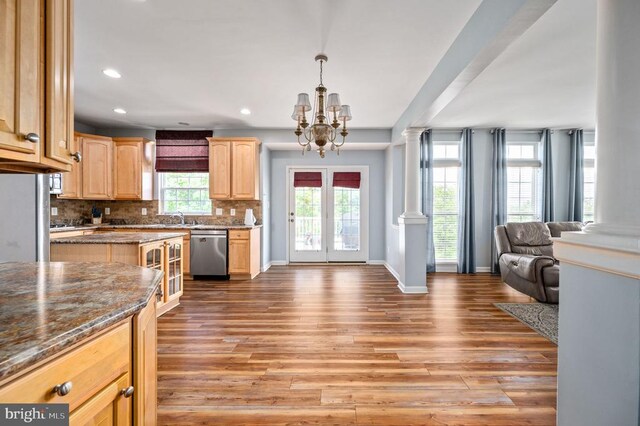 5606 Joshua Tree Cir, Fredericksburg, VA 22407 - kitchen with stainless steel dishwasher, open floor plan, light brown cabinetry, a chandelier, and wood finished floors