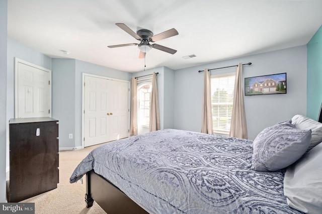 5606 Joshua Tree Cir, Fredericksburg, VA 22407 - bedroom with light carpet, multiple windows, a closet, and ceiling fan