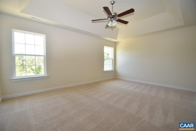 1193 Shenandoah Crossing Dr, Gordonsville, VA 22942 - spare room with a tray ceiling, light carpet, baseboards, and a ceiling fan