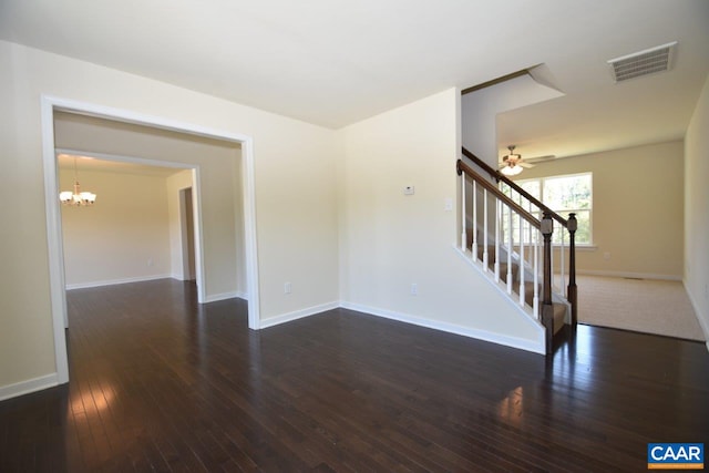 1193 Shenandoah Crossing Dr, Gordonsville, VA 22942 - unfurnished room featuring dark wood-style flooring, a chandelier, stairs, and a ceiling fan