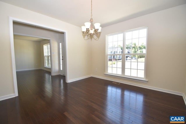 1193 Shenandoah Crossing Dr, Gordonsville, VA 22942 - spare room with an inviting chandelier, baseboards, dark wood-type flooring, and visible vents