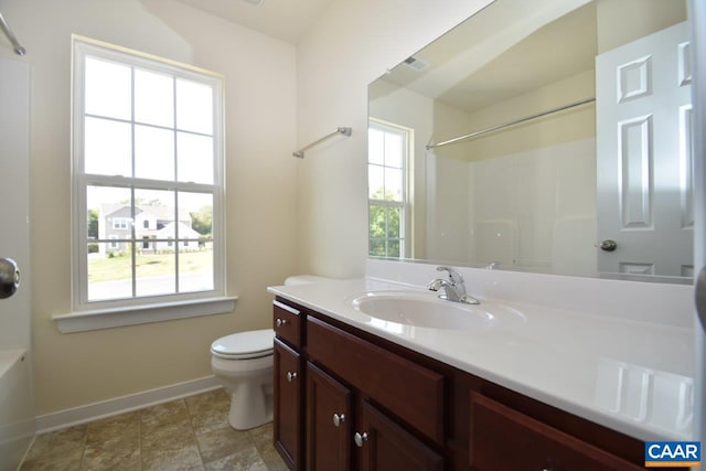 1193 Shenandoah Crossing Dr, Gordonsville, VA 22942 - bathroom with vanity, a wealth of natural light, baseboards, and toilet