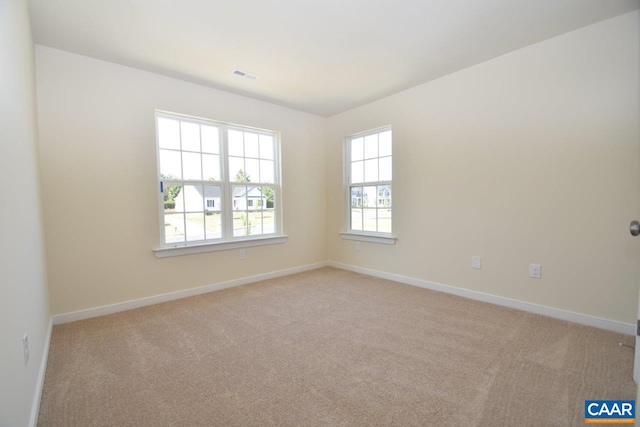 1193 Shenandoah Crossing Dr, Gordonsville, VA 22942 - empty room featuring light carpet, baseboards, and visible vents