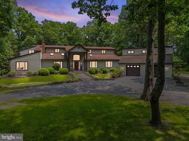 13013 Alum Springs Rd, Culpeper, VA 22701 - view of front facade featuring driveway, a front lawn, a chimney, and an attached garage