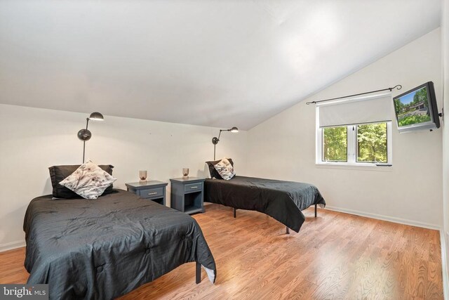 13013 Alum Springs Rd, Culpeper, VA 22701 - bedroom featuring vaulted ceiling, baseboards, and light wood-type flooring