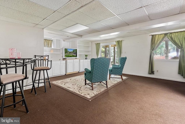 13013 Alum Springs Rd, Culpeper, VA 22701 - dining room with baseboards, healthy amount of natural light, dark carpet, built in shelves, and a paneled ceiling