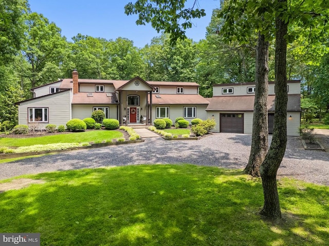13013 Alum Springs Rd, Culpeper, VA 22701 - view of front of property featuring gravel driveway, a front yard, a chimney, and an attached garage