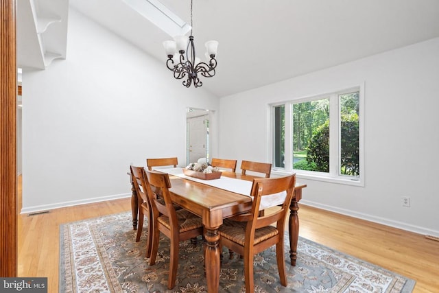 13013 Alum Springs Rd, Culpeper, VA 22701 - dining space featuring light wood-style floors, a chandelier, baseboards, and high vaulted ceiling