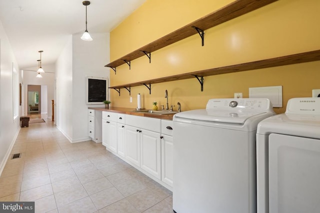 13013 Alum Springs Rd, Culpeper, VA 22701 - laundry room with cabinet space, independent washer and dryer, light tile patterned floors, and baseboards
