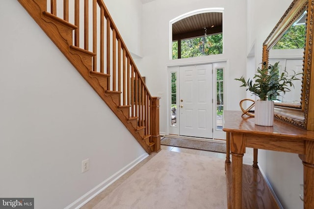 13013 Alum Springs Rd, Culpeper, VA 22701 - entryway with a towering ceiling, stairs, and baseboards