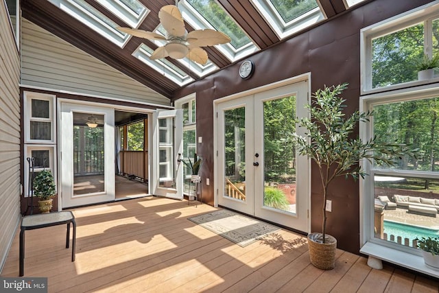 13013 Alum Springs Rd, Culpeper, VA 22701 - unfurnished sunroom featuring a skylight, french doors, vaulted ceiling, a ceiling fan, and plenty of natural light