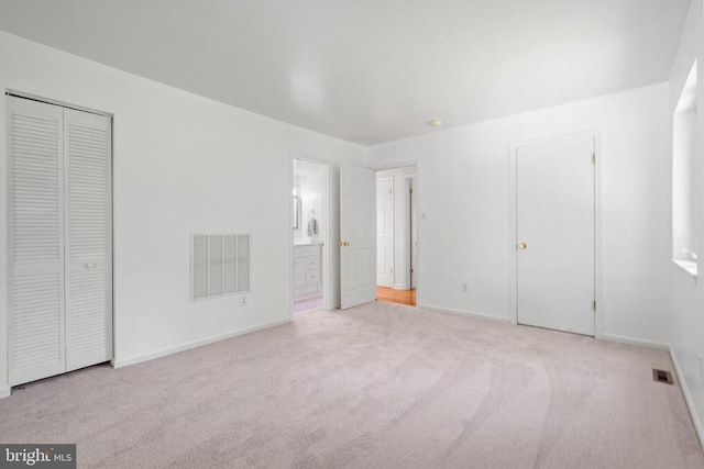 13013 Alum Springs Rd, Culpeper, VA 22701 - unfurnished bedroom featuring carpet floors, baseboards, ensuite bathroom, and a closet