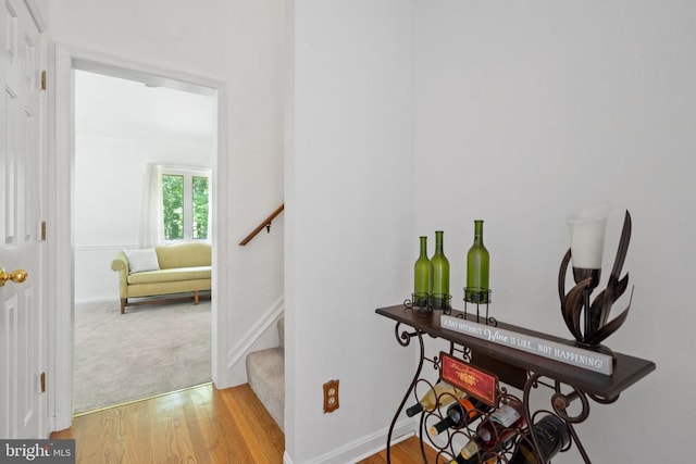 13013 Alum Springs Rd, Culpeper, VA 22701 - hall with light wood-type flooring, stairway, and baseboards
