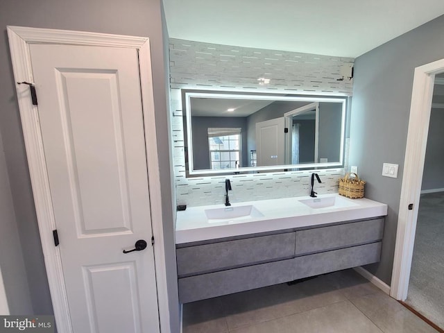 9423 Reservoir Rd, Fredericksburg, VA 22407 - full bath with double vanity, tile patterned flooring, baseboards, and decorative backsplash