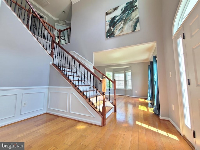 9423 Reservoir Rd, Fredericksburg, VA 22407 - foyer featuring a high ceiling, stairs, crown molding, and wood finished floors