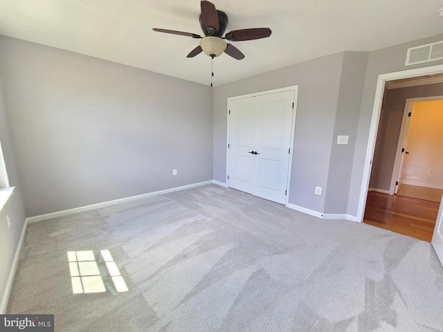 9423 Reservoir Rd, Fredericksburg, VA 22407 - unfurnished bedroom featuring carpet floors, baseboards, a closet, and a ceiling fan