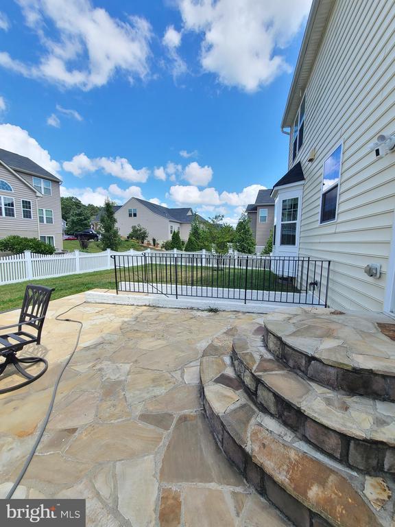 9423 Reservoir Rd, Fredericksburg, VA 22407 - fenced backyard with a patio