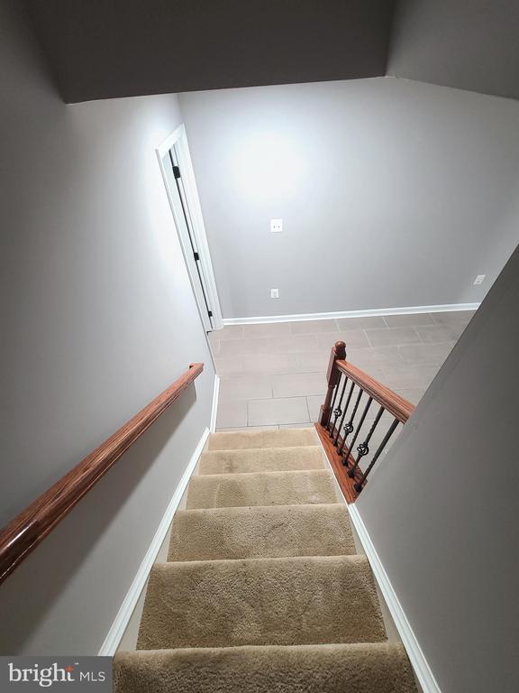 9423 Reservoir Rd, Fredericksburg, VA 22407 - stairway with baseboards