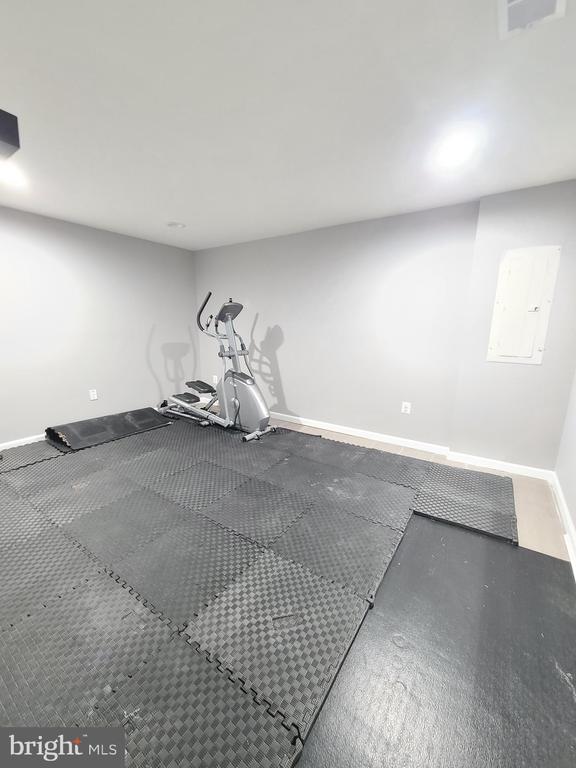 9423 Reservoir Rd, Fredericksburg, VA 22407 - exercise area with baseboards and electric panel