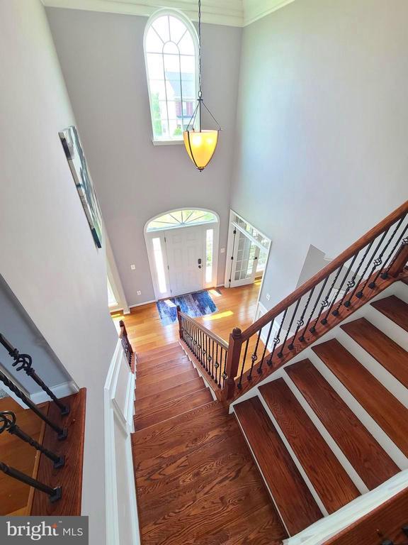 9423 Reservoir Rd, Fredericksburg, VA 22407 - stairs with wood finished floors and a high ceiling