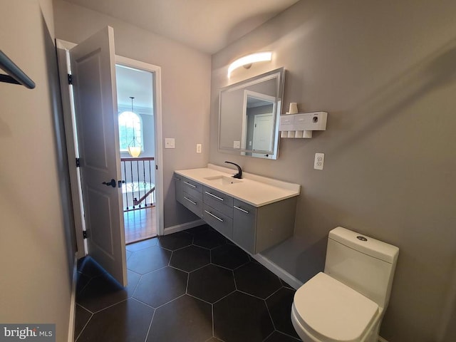 9423 Reservoir Rd, Fredericksburg, VA 22407 - half bath with vanity, toilet, tile patterned flooring, and baseboards